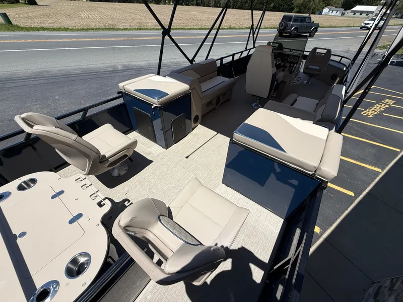 Slide: The Image of 2025 Avalon 2585 Venture 85 Tri Toon boat interior with seating and console. - 11