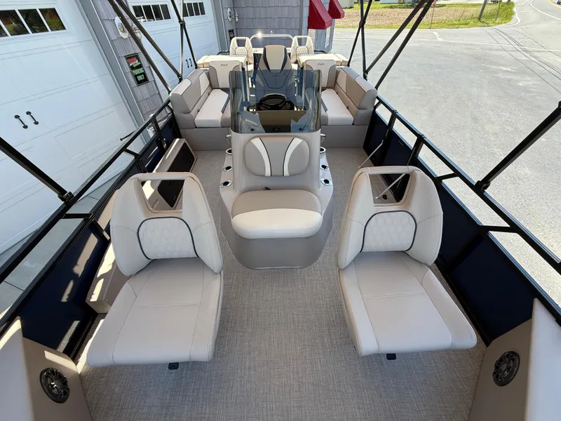 Slide: The Image of 2025 Avalon 2585 Venture 85 boat interior with center console and plush seating. - 16