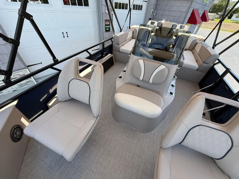 Slide: The Image of 2025 Avalon 2585 Venture 85 Tri Toon boat with luxurious seating and center console. - 17