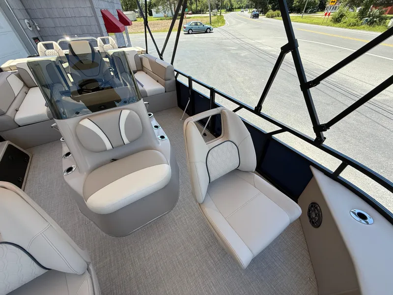 Slide: The Image of 2025 Avalon 2585 Venture 85 boat interior with plush seating and center console. - 18