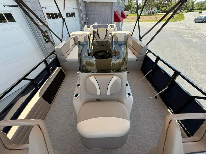 Slide: The Image of 2025 Avalon 2585 Venture 85 Tri Toon boat interior with center console and seating. - 19