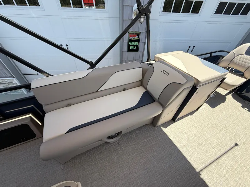 Slide: The Image of 2025 Avalon 2585 Venture boat interior with beige seating and modern design. - 24