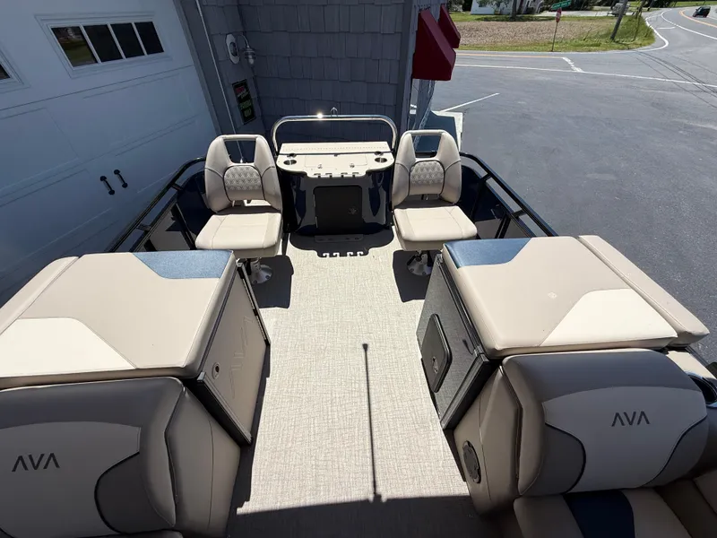 Slide: The Image of 2025 Avalon 2585 Venture 85 Tri Toon boat interior with center console and seating. - 25