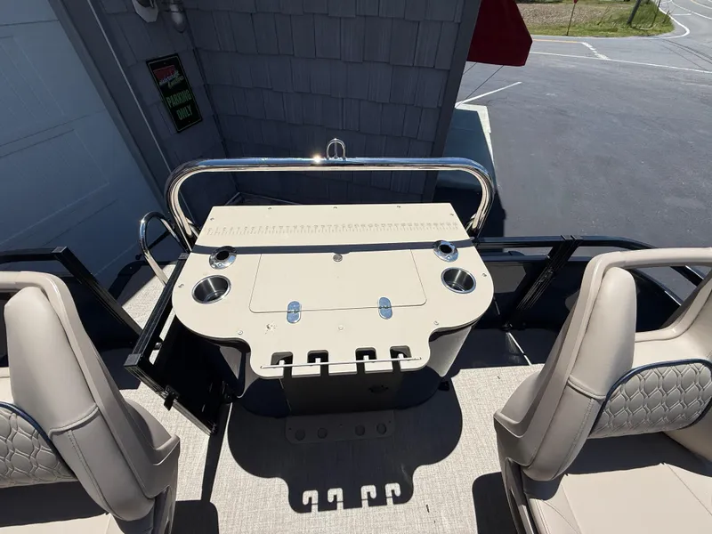 Slide: The Image of 2025 Avalon 2585 Venture 85 center console with seating and fishing rod holders. - 27