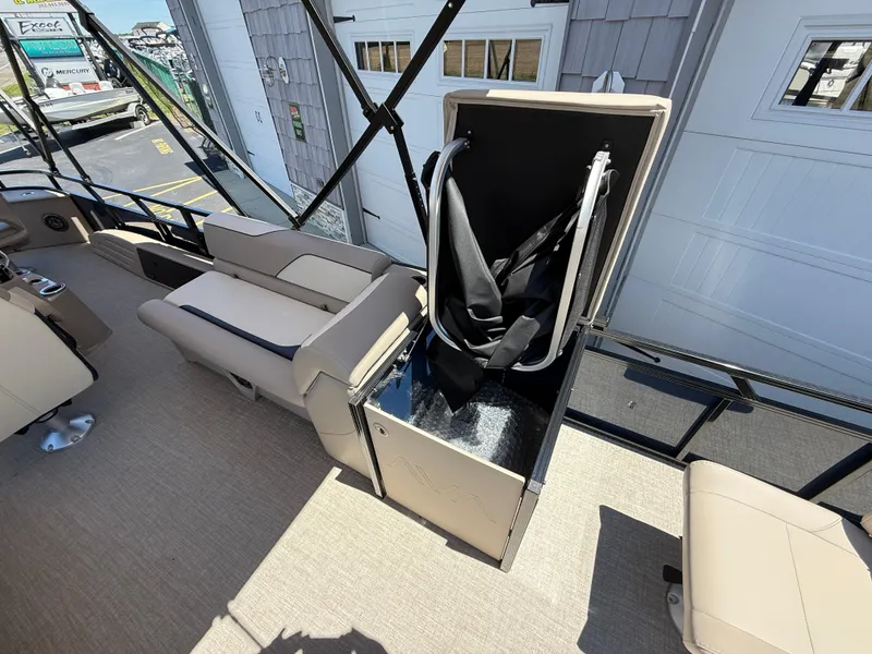 Slide: The Image of 2025 Avalon 2585 Venture 85 Tri Toon boat interior with open storage compartment. - 28