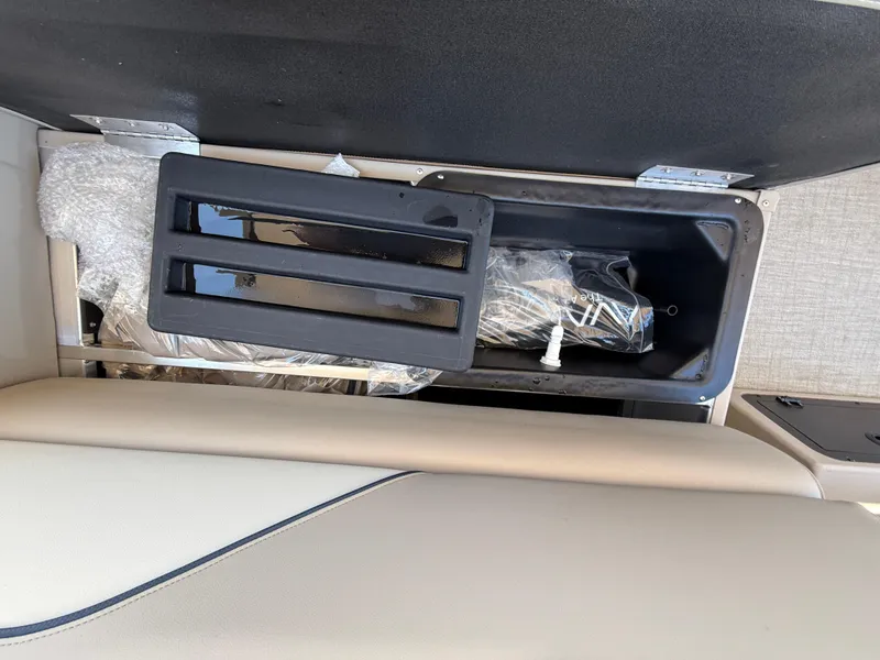 Slide: The Image of Open storage compartment in 2025 Avalon 2585 Venture 85 boat. - 29