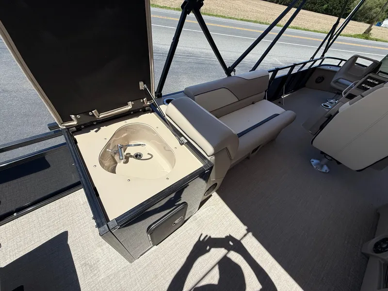 Slide: The Image of 2025 Avalon 2585 Venture 85 boat interior with seating and console. - 30