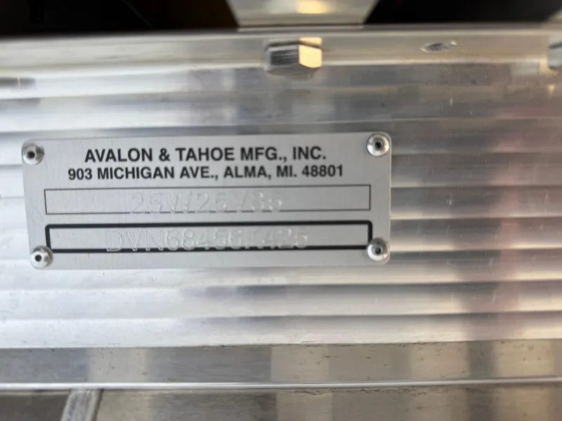 Slide: The Image of Metal identification plate on Avalon 2585 Venture 85 boat, displaying manufacturer details. - 33