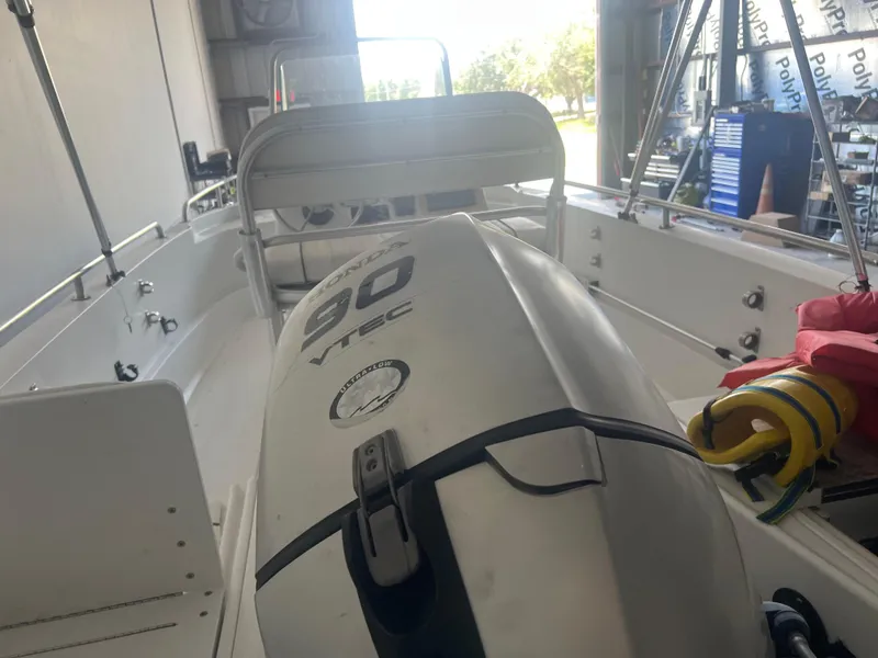 Slide: The Image of 2009 Triumph 190 Bay boat with 90 VTEC engine in a storage facility. - 5
