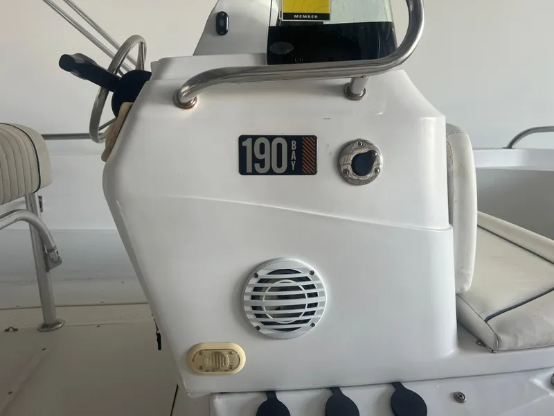 Slide: The Image of 2009 Triumph 190 Bay boat console with steering wheel and seating. - 7