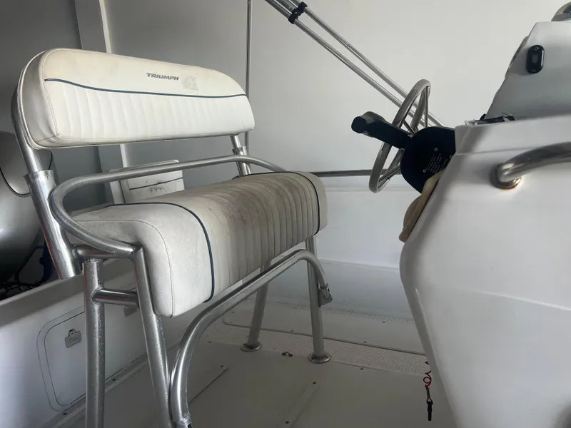 Slide: The Image of 2009 Triumph 190 Bay boat interior with steering wheel and seating. - 8