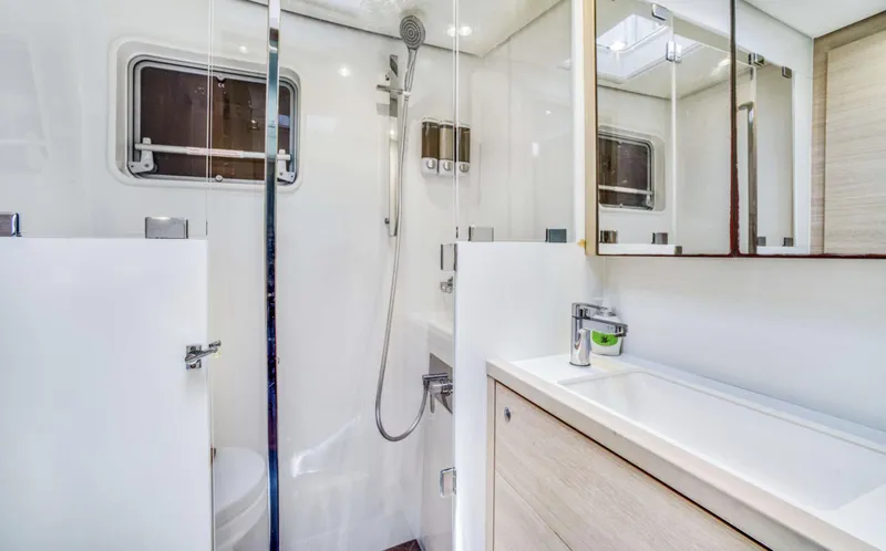 Slide: The Image of Modern bathroom interior of 2020 Lagoon 620 yacht, featuring sleek design and fixtures. - 15