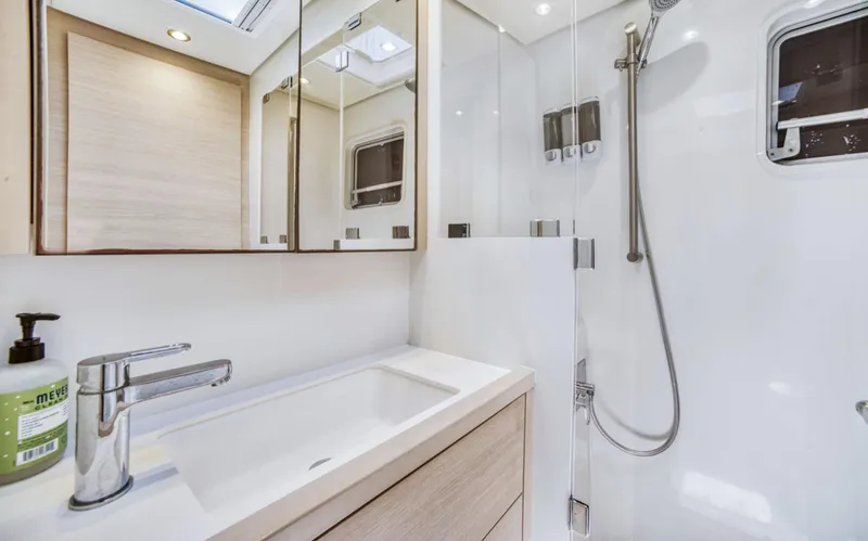 Slide: The Image of Modern bathroom in 2020 Lagoon 620 yacht with sleek fixtures and natural lighting. - 17