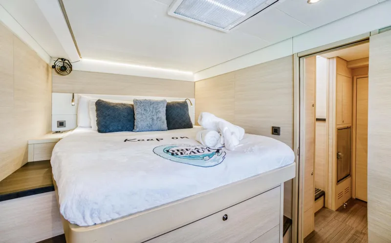 Slide: The Image of Luxurious bedroom interior of 2020 Lagoon 620 yacht with cozy bedding and modern design. - 18