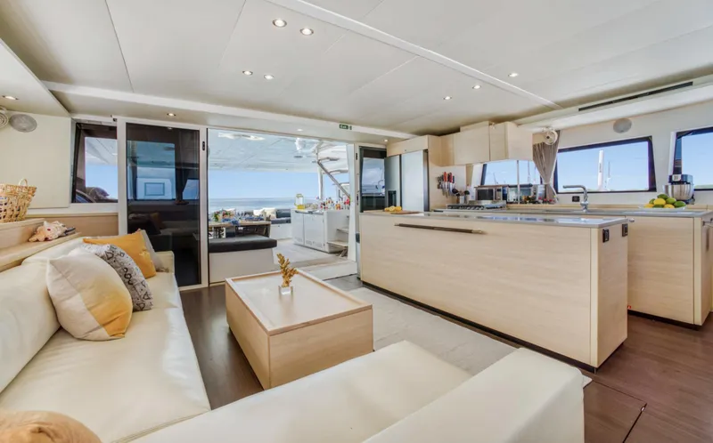 Slide: The Image of Luxurious interior of 2020 Lagoon 620 yacht with modern kitchen and seating area. - 6