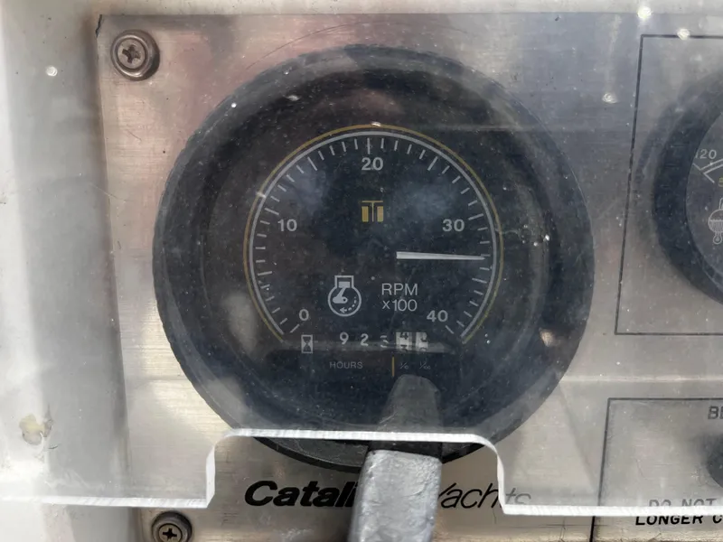 Slide: The Image of Instrument panel of a 1987 Catalina 34 yacht showing RPM gauge. - 13
