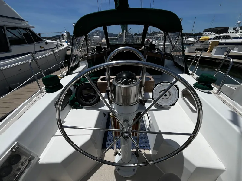 Slide: The Image of Cockpit of a 1987 Catalina 34 sailboat with steering wheel and navigation instruments. - 14