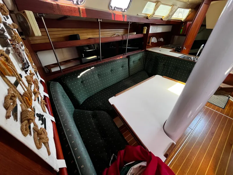 Slide: The Image of Interior of a 1987 Catalina 34 sailboat with a cozy dining area. - 20