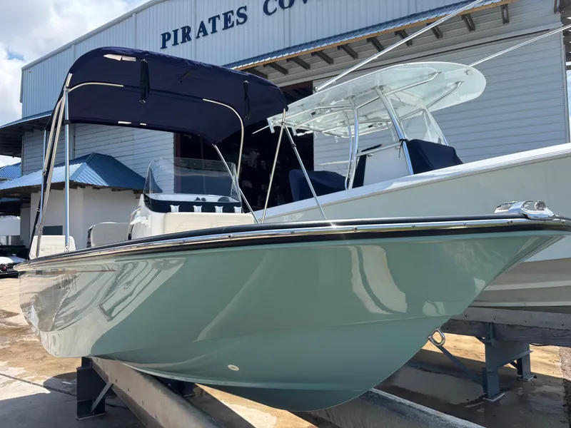 Slide: The Image of 2024 Boston Whaler 170 Montauk boat with canopy at Pirates Cove marina. - 0