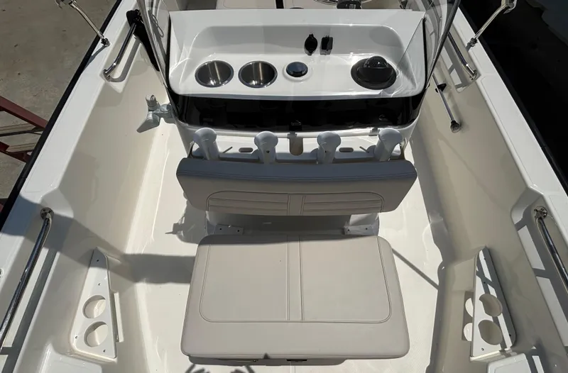 Slide: The Image of 2024 Boston Whaler 170 Montauk boat interior with seating and console features. - 21