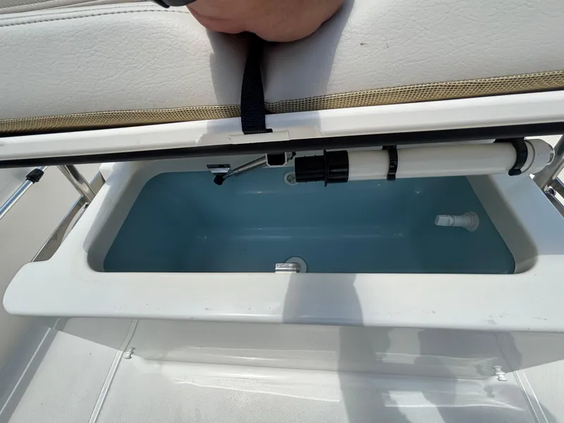 Slide: The Image of 2024 Boston Whaler 170 Montauk boat storage compartment with open lid. - 22