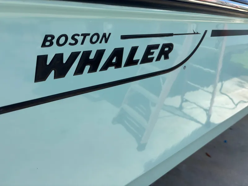 Slide: The Image of 2024 Boston Whaler 170 Montauk boat side view with logo. - 3