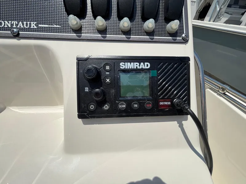 Slide: The Image of Simrad marine radio on 2024 Boston Whaler 170 Montauk dashboard. - 9