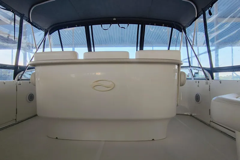 Slide: The Image of 2002 Silverton 43 Motor Yacht interior with seating and helm, featuring a sleek design. - 10