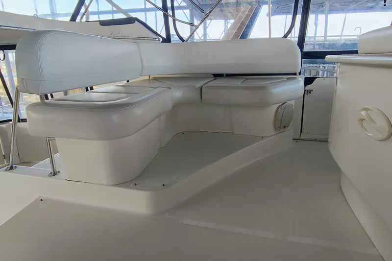 Slide: The Image of 2002 Silverton 43 Motor Yacht interior with seating and spacious layout. - 11