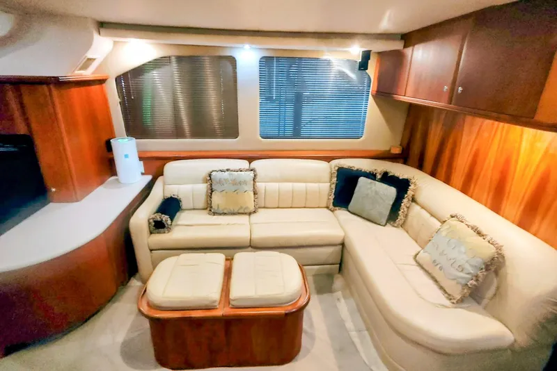Slide: The Image of Luxurious interior of 2002 Silverton 43 Motor Yacht with plush seating and elegant wood finishes. - 20