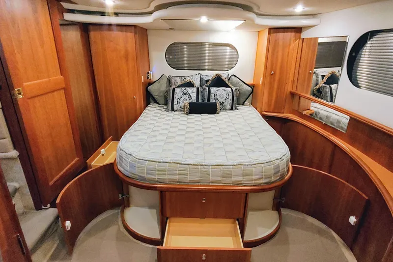 Slide: The Image of Luxurious bedroom interior of 2002 Silverton 43 Motor Yacht with elegant wood finish. - 26