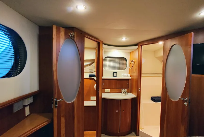 Slide: The Image of Interior of 2002 Silverton 43 Motor Yacht with wood finish and modern amenities. - 29