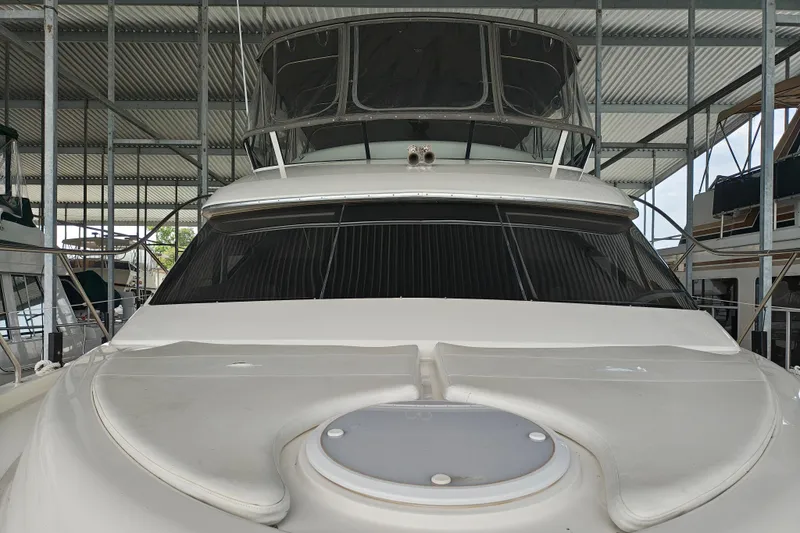 Slide: The Image of 2002 Silverton 43 Motor Yacht in covered dock, front view. - 3