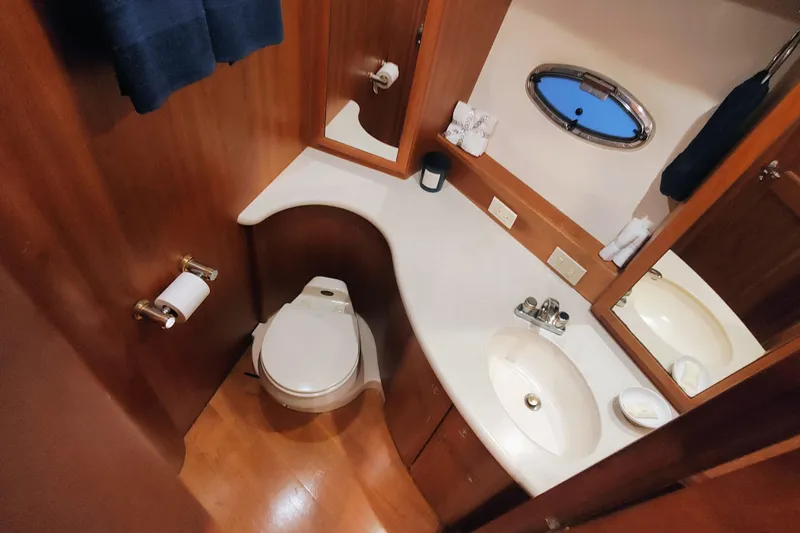 Slide: The Image of Luxurious bathroom in 2002 Silverton 43 Motor Yacht with wood accents and modern fixtures. - 35