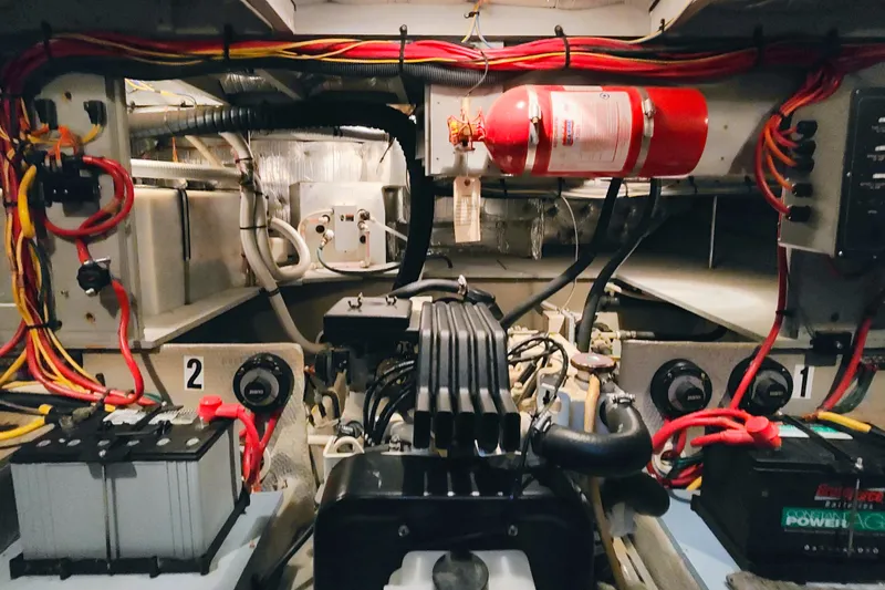 Slide: The Image of Engine room of a 2002 Silverton 43 Motor Yacht with wiring and fire extinguisher. - 42