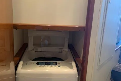 Slide: The Image of Compact washing machine in a 2002 Viking 55 Convertible yacht interior. - 11