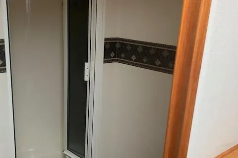 Slide: The Image of Shower area inside 2002 Viking 55 Convertible yacht with decorative wall trim. - 13