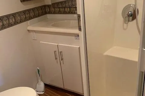 Slide: The Image of Bathroom interior of 2002 Viking 55 Convertible yacht with shower and sink. - 14