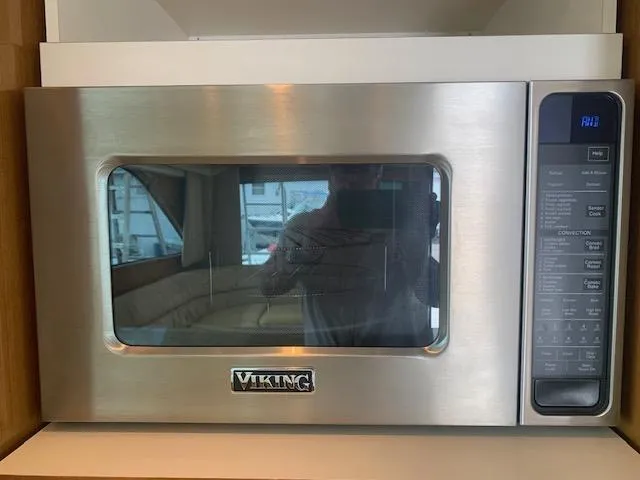 Slide: The Image of Stainless steel Viking microwave in a 2002 Viking 55 Convertible yacht kitchen. - 17