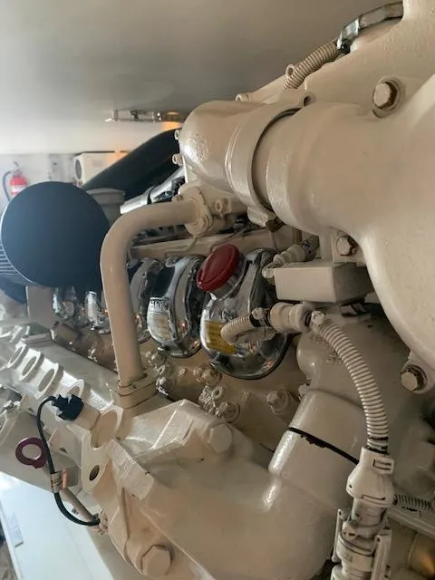 Slide: The Image of Engine of a 2002 Viking 55 Convertible yacht, showcasing intricate mechanical components. - 24