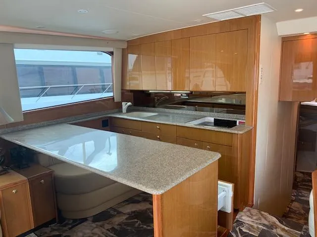 Slide: The Image of Luxurious kitchen interior of 2002 Viking 55 Convertible yacht with modern amenities. - 3