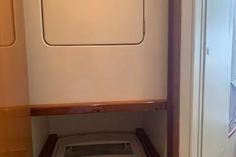 Slide: The Image of Laundry area inside a 2002 Viking 55 Convertible yacht. - 32