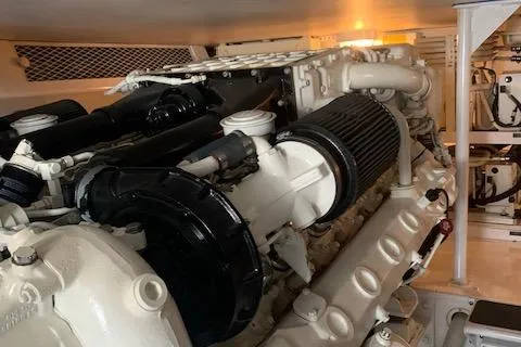 Slide: The Image of Engine room of 2002 Viking 55 Convertible yacht, showcasing powerful marine engine components. - 39