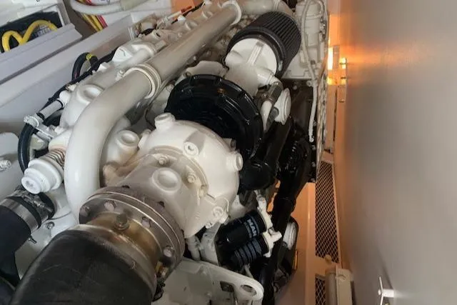 Slide: The Image of Engine room of 2002 Viking 55 Convertible yacht, showcasing detailed machinery components. - 40