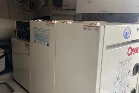 Slide: The Image of Engine room of 2002 Viking 55 Convertible yacht with Onan generator. - 43