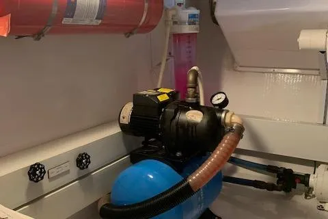 Slide: The Image of Engine room of 2002 Viking 55 Convertible with pump and fire extinguisher. - 46