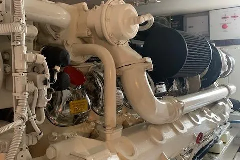 Slide: The Image of Engine room of a 2002 Viking 55 Convertible yacht, showcasing detailed machinery components. - 49