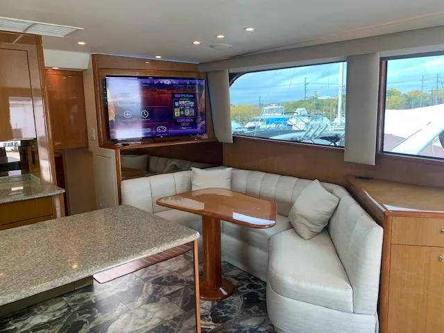 Slide: The Image of Luxurious interior of 2002 Viking 55 Convertible yacht with plush seating and modern amenities. - 5