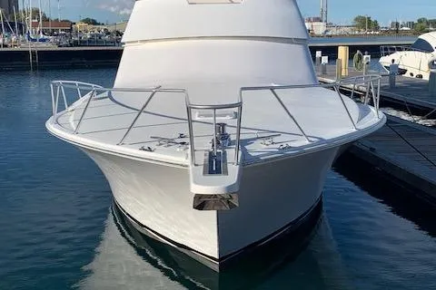 Slide: The Image of 2002 Viking 55 Convertible yacht docked in a marina, front view. - 7