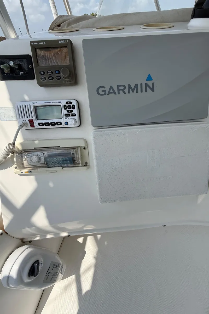 Slide: The Image of 2004 Luhrs 36 Convertible boat dashboard with Garmin navigation system. - 10
